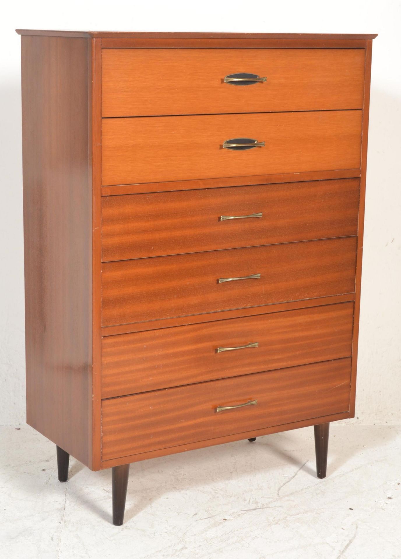 A retro 1950's / mid century teak wood pedestal chest of drawers. Raised on turned legs with a