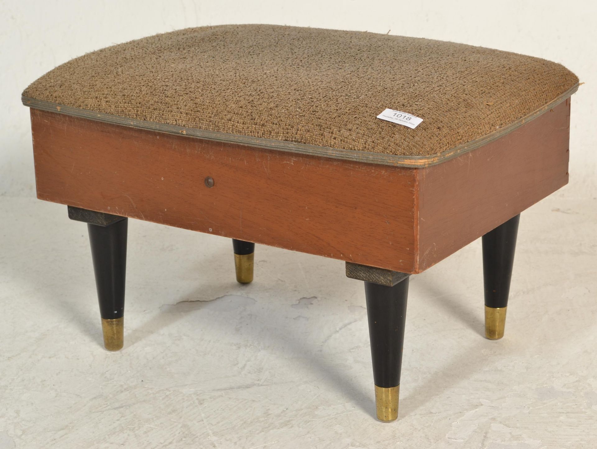 A retro mid century, circa 1950's teak wood and upholstered foot stool sewing box. The upholstered