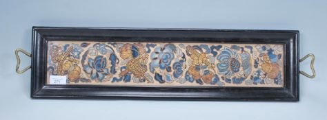 A 19th Century possibly Chinese ebonised twin handled tray,the tray having an embroidered liner with