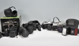A good group of cameras to include a Canon EOS 750 having a Canon zoom lens EF 35-105mm and