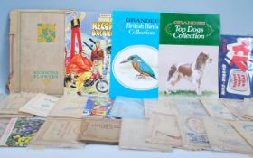 A collection of vintage cigarette and confectionery trade cards within albums. Mostly full sets to