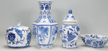 A group of four 20th Century Chinese blue and white ceramics to include a bulbous form jar hand