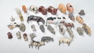 A small group of early 20th Century lead animal farm figures in play worn condition and of varying