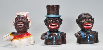 A group of three replica Little Joe style cast iron money banks to include two male figures and a