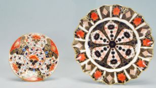 A Royal Crown Derby Imari pattern plate no. 1128 having a fanned rim gilt detailing and a small hand
