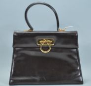 A ladies designer Italian made leather hand bag by Salvatore Ferragamo, carry handle to the top with