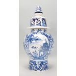 A large  blue and white delft lidded jar of bulbous form with typical Chinese decoration to the