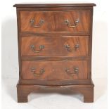 A 20th Century mahogany Regency revival chest of drawers, the serpentine chest of three drawers