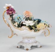 A 20th Century Italian Capodimonte ceramic flower basket figurine having ceramic modelled flowers