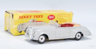 A vintage Dinky Toys Diecast Bentley Coupe S2 toy model car no.194 complete with original box.