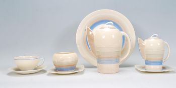 An early 20th Century Art Deco Susie Cooper bachelors / part tea service of shapely form having blue