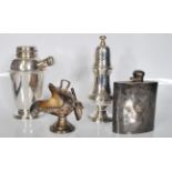 A small group of silver plate items to include a vintage cocktail shaker, sugar shaker, hip flask of