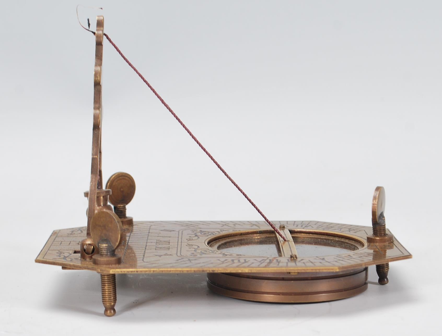 A 20th Century cased brass Sundial Compass, the compass set within the folding metamorphic - Image 6 of 9