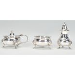 A set of three Georgian style silver plate condiments consisting of pepperette, table salt and