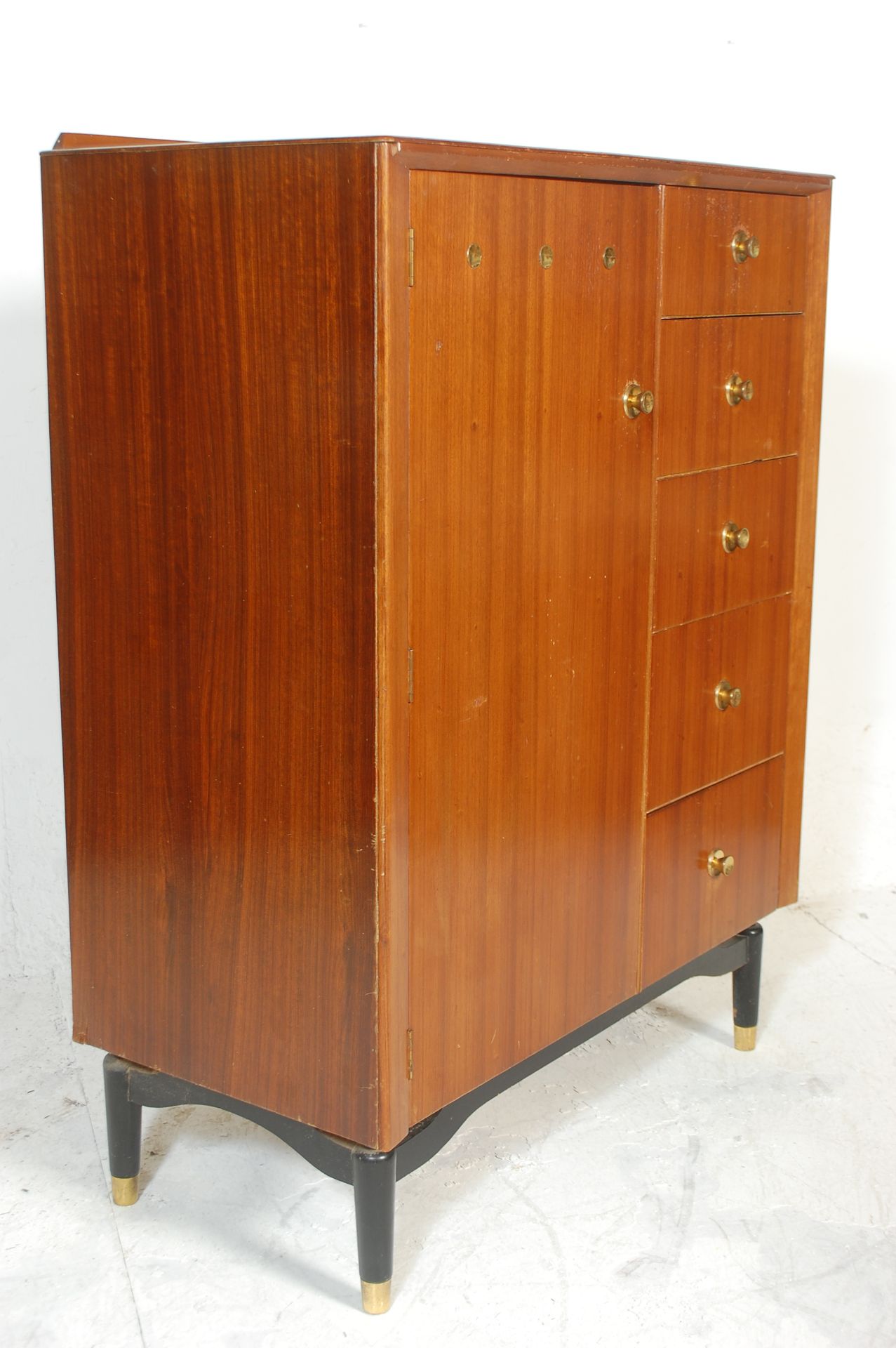 A vintage / retro mid 20th Century tallboy having full length hanging cupboard to the left alongside