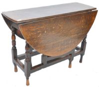 A 17th Century oak gateleg dining table having an elliptical twin drop leaf top raised on block