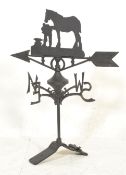 A 20th Century cast iron weather vane having North South East and West appendages with rotating
