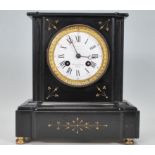 A Victorian 19th century slate mantel clock with the dial being marked for Paris. Inset brass 8