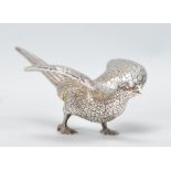A good silver plated heavy cast metal Pheasant paperweight ornament of a fighting cock in an