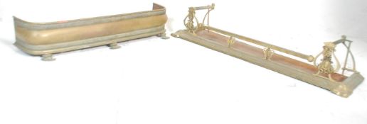 Two vintage 20th Century brass fire fenders. One of Art Nouveau style having moulded floral and