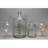 A pair of vintage style pedestal glass sweet jars together with two graduating glass olive / oil