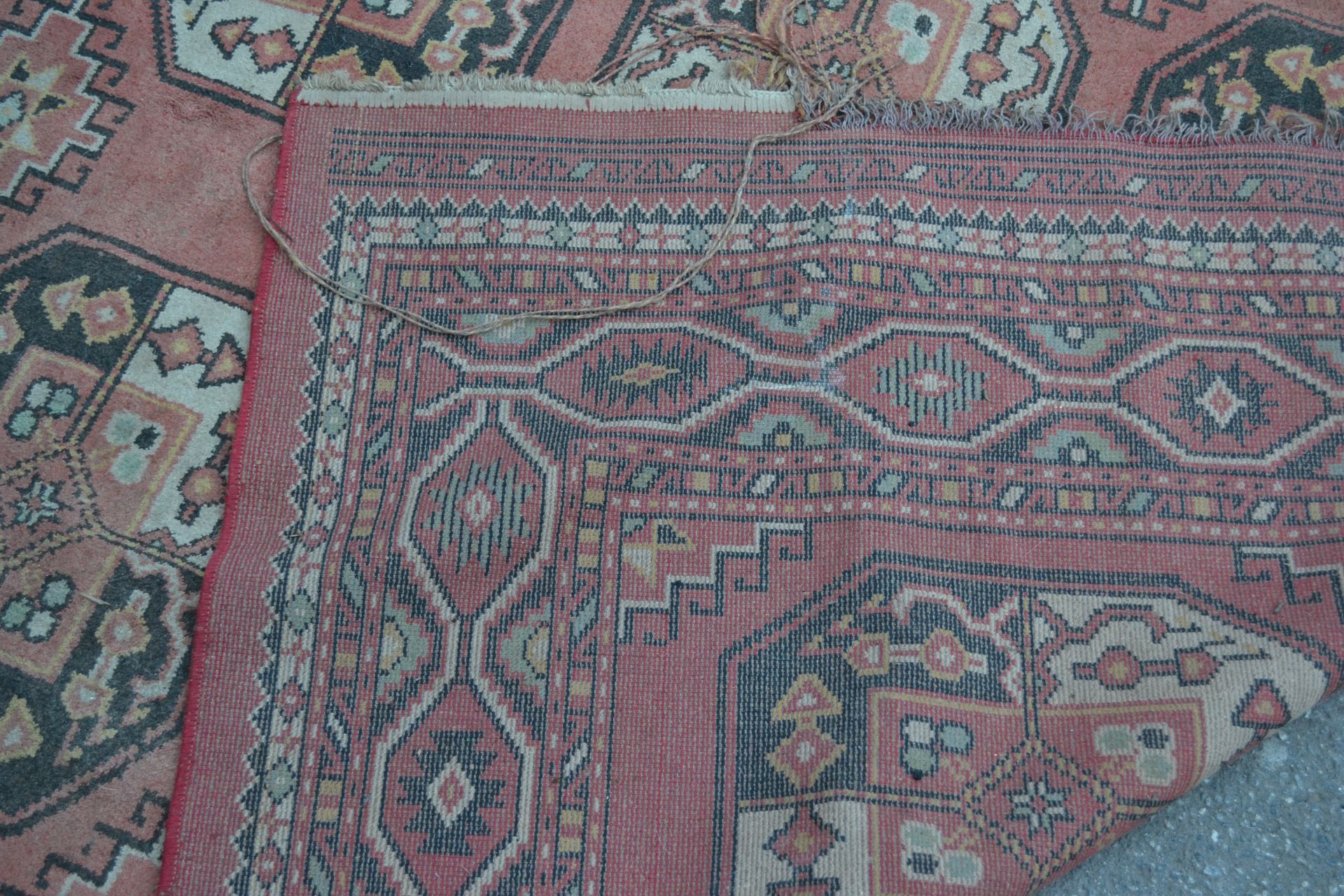 A large 20th Century Persian Islamic floor rug having a red ground with black and white geometric - Bild 3 aus 3