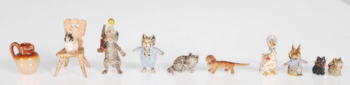 A fantastic collection of nine early 20th Century cold painted bronze Beatrix Potter miniature Peter