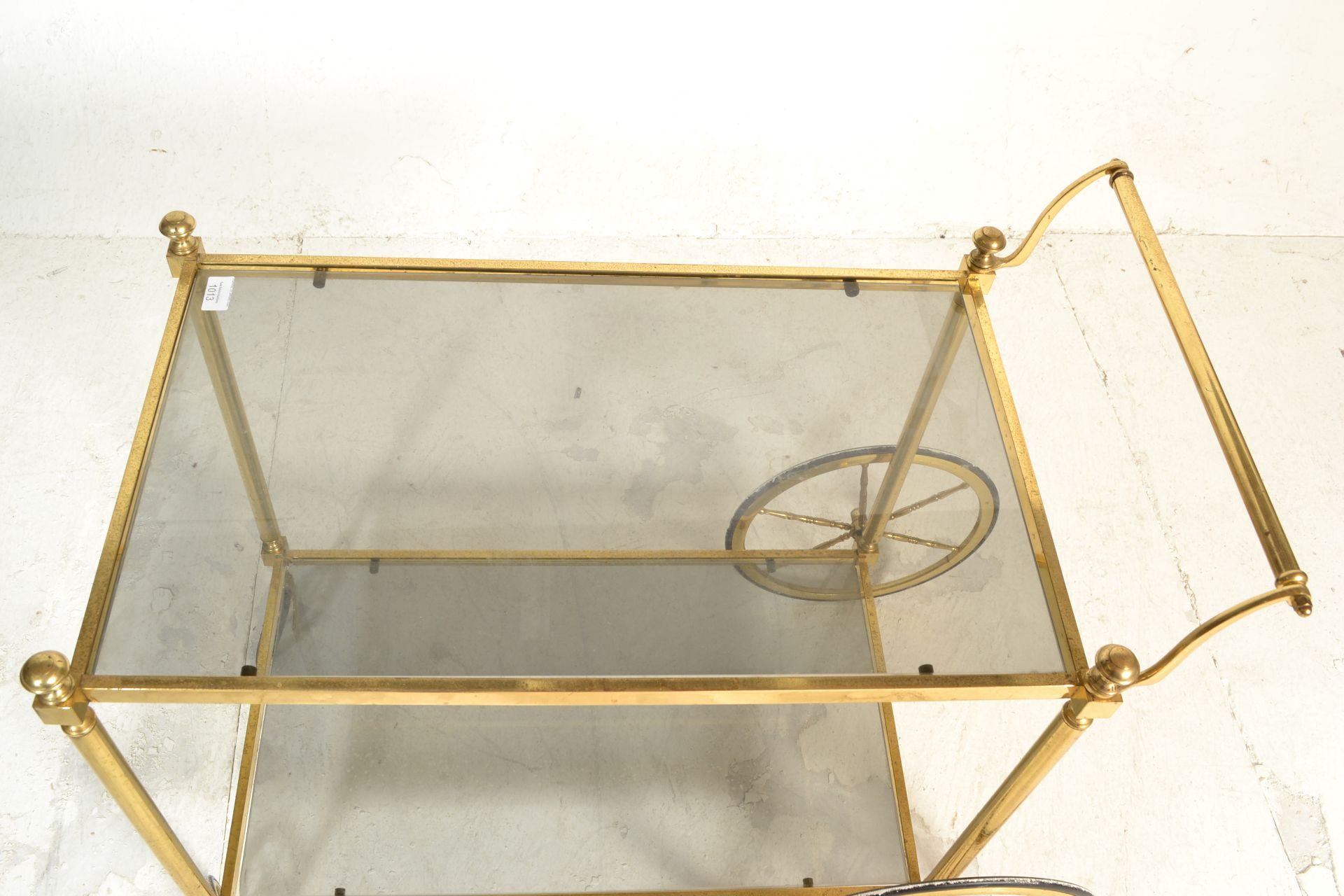 A mid century italian brass and smoked glass trolley table raised on original castors having twin - Bild 5 aus 5