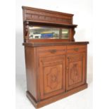 A 19th century Victorian rosewood chiffonier with raised mirror back above two cupboard doors raised