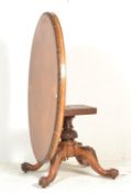 A Victorian 19th century burr walnut tilt top breakfast / loo table raised on bulbous base with