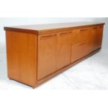 A retro 20th Century teak wood lowboard / sideboard having a configuration of two central drawers