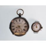 A silver open face pocket watch having a white enamel face with Roman numeral chapter ring with