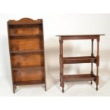 An early 20th Century Arts and Crafts floor standing oak book trough / bookcase, two inverted