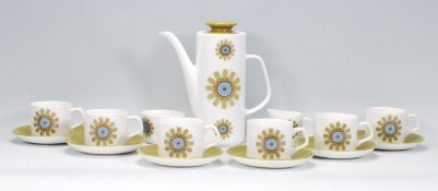 A vintage retro 1970's J & G Meakin coffee service consisting of six tea cups and saucers, creamer