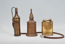 A small group of early 20th Century brass oil lamps / burners. One being French made 'Pigeon Lampe