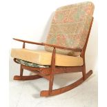 A retro 20th Century Scandart oak framed rocking chair / armchair being raised on sleigh runners