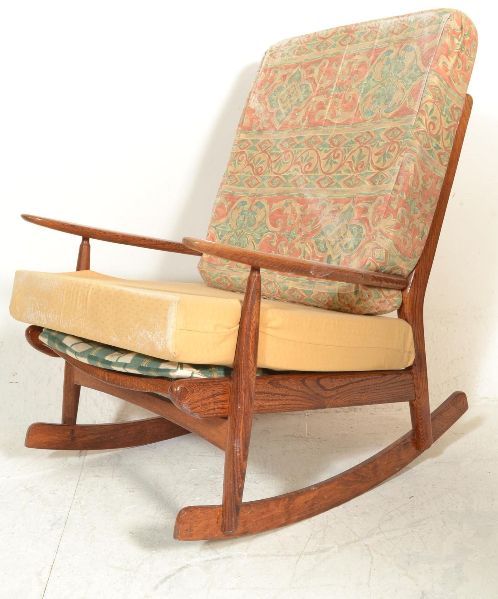 A retro 20th Century Scandart oak framed rocking chair / armchair being raised on sleigh runners