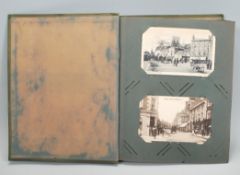 A vintage postcard album containing many cards to include topographical, Naval, Military, Humour and