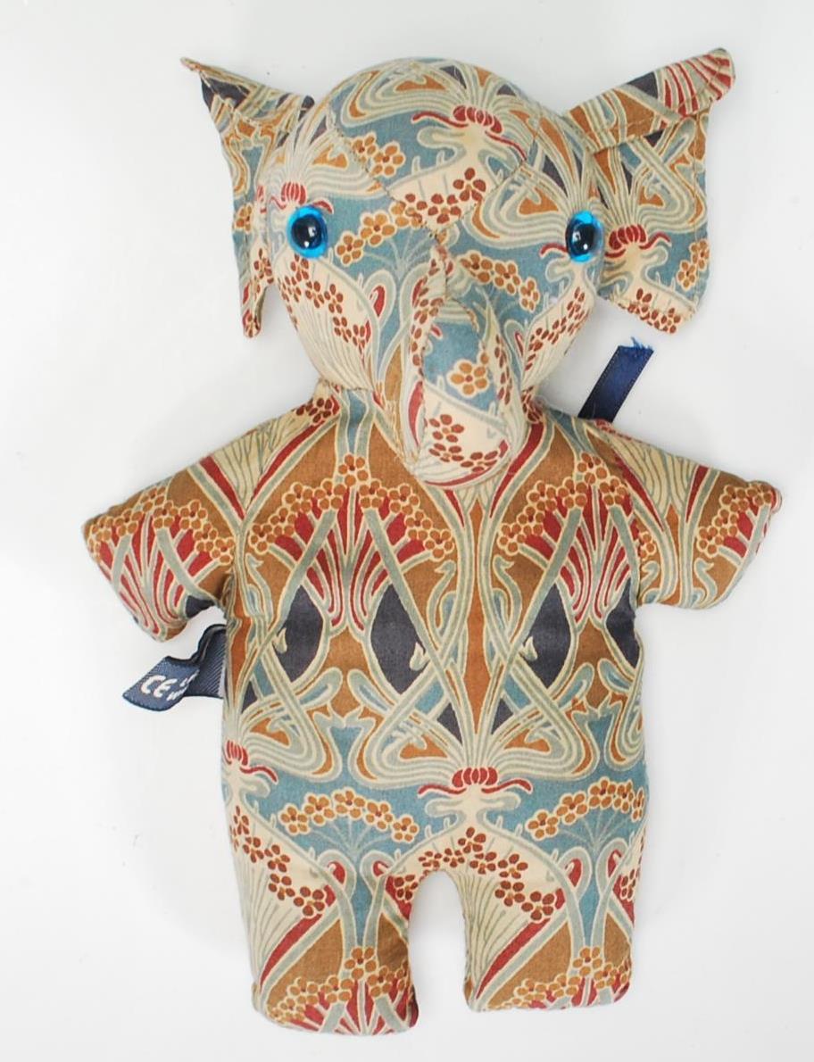 A 20th Century Liberty & Co London handmade elephant beanie toy made from decorative Art Nouveau