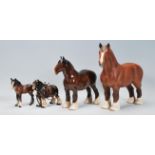 A group of Beswick ceramic horses to include a mat