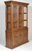 A French antique style dresser / library bookcase cabinet. The base with double doors having unusual