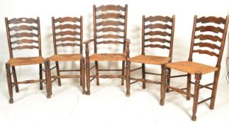 A set of five vintage country 20th Century oak ladderback dining chairs, one being a carver having