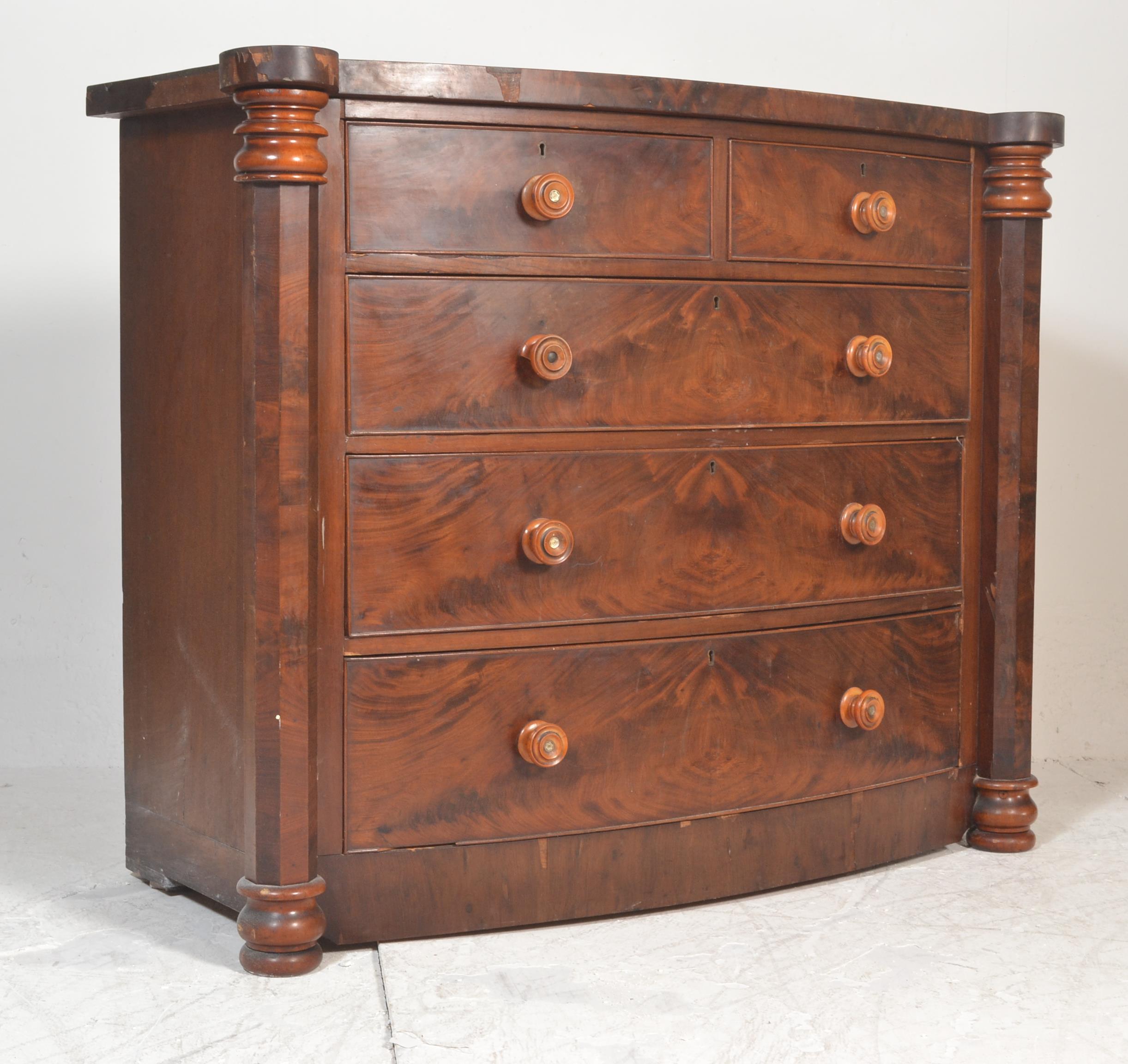 A 19th Century Victorian mahogany bow fronted two over three chest of drawers having turned knob