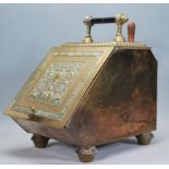 A 19th Century Victorian Aesthetic movement brass coal scuttle, carry handle to top with decorated