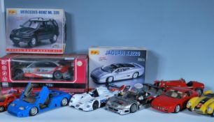 A mixed collection of precision diecast 1:18 scale model cars to include four Burago examples Alfa