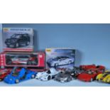 A mixed collection of precision diecast 1:18 scale model cars to include four Burago examples Alfa
