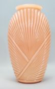 A 20th Century Art Deco pink shell vase of tapering form having a draped / ribbed decorated body.