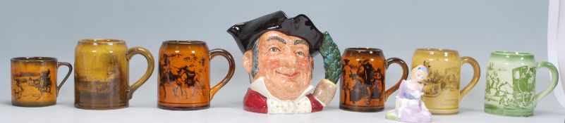 A Royal Doulton toby character jug entitled Mine Host D6468, A Royal Doulton figurine of Mary Had