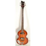 A good vintage Hofner style left handed violin bass guitar having a sunburst body with white control