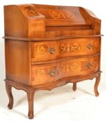 A 20th Century drop front desk bombe bureau chest of serpentine front having two drawers to the